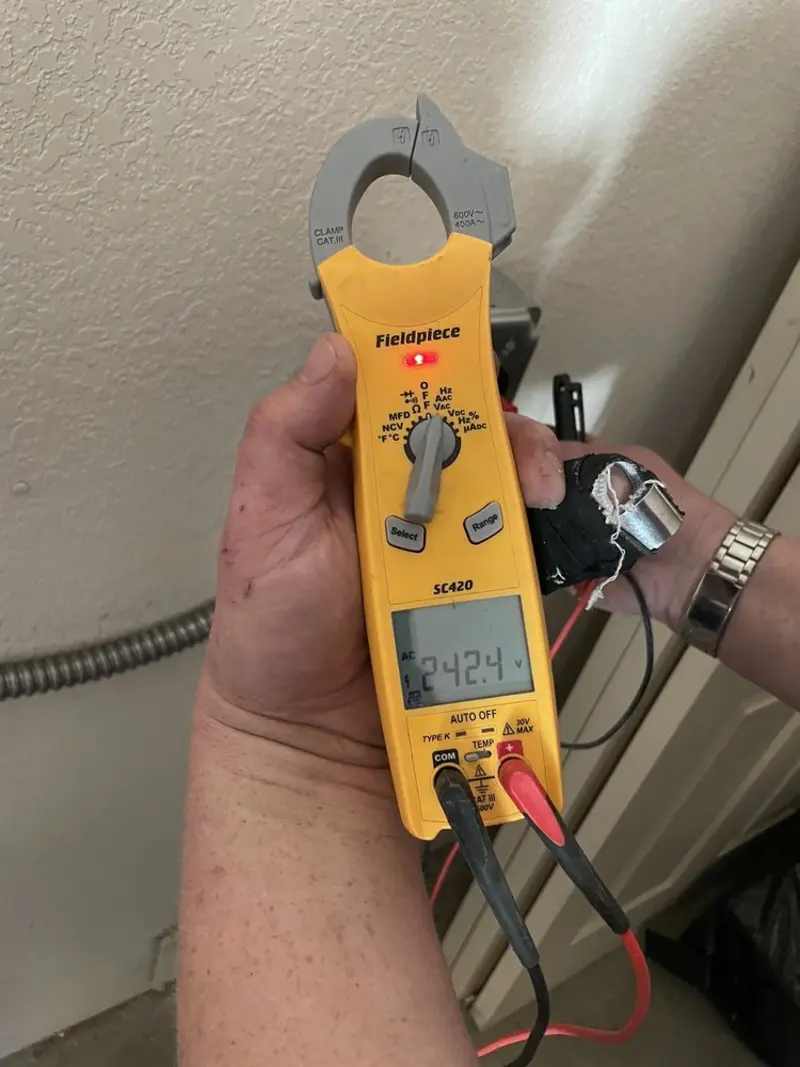 Voltage testing with clamp meter during Electrical Installation Services in Punxsutawney